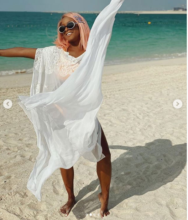 DJ Cuppy rocks a see through luxury Dress at the beach in Dubai
